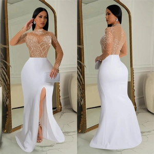 Elegant rhinestone evening gown with nude sheer mesh top and high slit white floor-length skirt