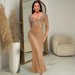 Detail of nude long sleeve dress with complex geometric rhinestone embellishments and slim fit