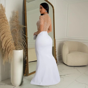 Detailed view of white slim fit maxi dress with sparkling silver rhinestones and mesh top