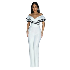 Detail of off-shoulder neckline with black ruffled edges on a white fitted jumpsuit