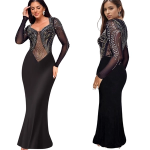 Close-up of sparkling rhinestones and sheer mesh detailing on this black evening gown