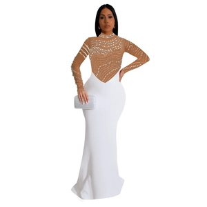 Detail of sheer mesh bodice with silver sequins and white floor-length evening gown