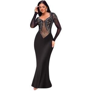 Close-up of black bodycon evening dress featuring intricate gold and silver rhinestones