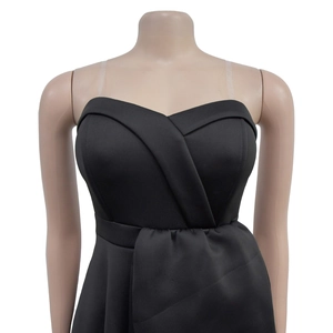 Close-up of black strapless midi dress featuring criss-cross wrap bodice and clear straps