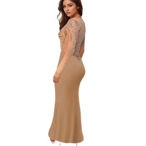 Close-up of nude floor-length gown featuring sparkling rhinestones on sheer bodice