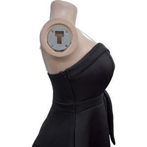Detailed view of the side hidden zipper on a black sleeveless strapless midi dress