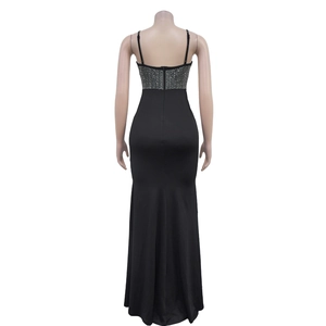 Detail of elegant black evening gown showing silver rhinestone embellishments on the back