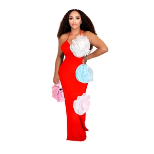 Detail of red halter maxi dress featuring three large 3D organza floral decorations