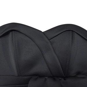 Detailed view of black sweetheart neckline with crossover fabric design on the dress