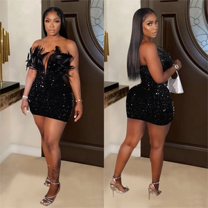 Sleeveless black sequin mini dress featuring feathered neckline for elegant party wear