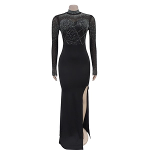 Detail of high-slit black evening dress featuring sparkling rhinestones on mesh bodice