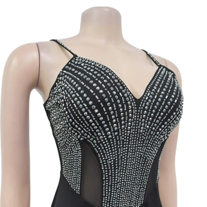 Close-up of V-neck bodysuit with silver rhinestones and sheer mesh side panels