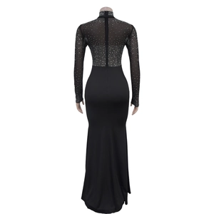 Detailed view of long sleeve mesh top with sparkling silver rhinestones on black evening gown