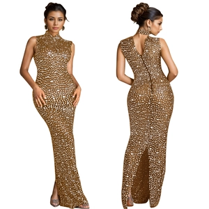 Detail of elegant gold rhinestone maxi dress with sleeveless high neck and back cutout