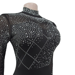 Close-up of black mesh bodice featuring intricate silver rhinestone geometric patterns