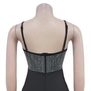 Detail of black V-neck dress featuring silver rhinestones and adjustable straps