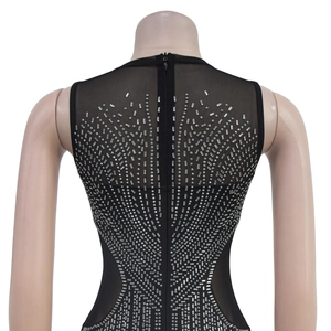 Detail of black rhinestone sleeveless dress featuring mesh patchwork and back zipper