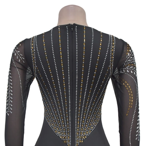 Macro shot of back zipper and sparkling rhinestones on black sheer mesh sleeves