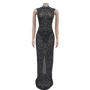 Detail of silver rhinestones and sheer black mesh fabric on a sleeveless maxi dress