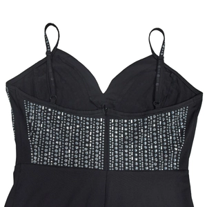 Detail of deep V-neckline on black dress with sparkling silver rhinestone embellishments
