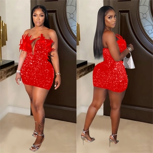 Sparkling red sequin bodycon mini dress with feather trim for evening party wear