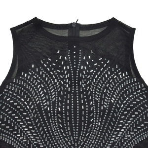 Detail of black sleeveless dress featuring mesh neckline and sparkling silver rhinestones