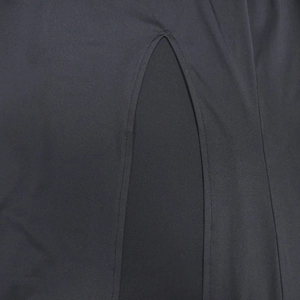 Detail view of the high-slit design and neat stitching on a black sleeveless dress