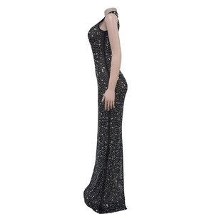 Detailed view of shimmering silver rhinestones on a black sleeveless maxi evening gown