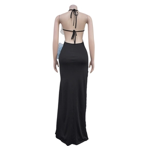 Back view of a black backless maxi dress featuring halter straps and side floral detail