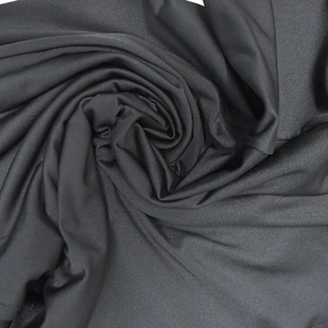 Detailed macro view of black rhinestone evening dress fabric showing soft draped texture