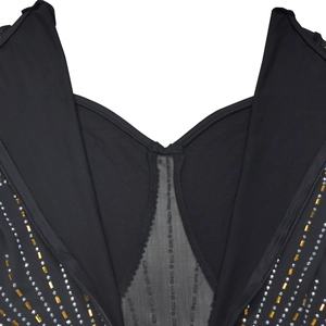 Detail of V-neckline with black mesh insert and gold and silver rectangular sequins