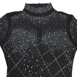 Detail of black mesh dress featuring silver rhinestone geometric patterns and zipper collar
