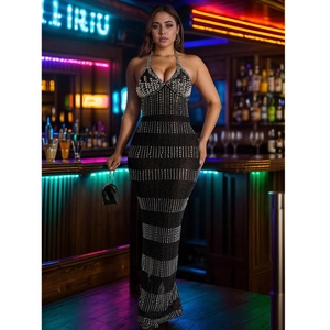 Detail of elegant black halter dress with shimmering silver sequins and crystal embellishments