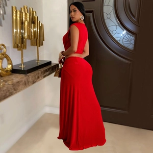 Detail view of bright red sleeveless crop top and slim fit maxi skirt set on model
