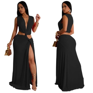 Detail of a black sleeveless deep V-neck dress with waist cutout and high side slit