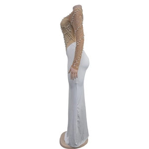 Detail of sheer mesh bodice with rhinestones and pearls on white mermaid evening dress