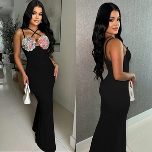 Elegant black knit sleeveless maxi dress featuring vibrant crochet flower details and slim fit
