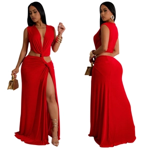 Detail view of red deep V-neck dress featuring waist cut-outs and a high side slit