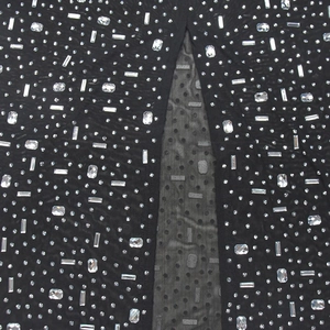 Detailed macro view of black mesh fabric with sparkling rhinestones for evening dresses