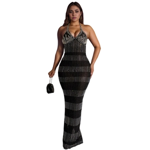 Close-up of black halter dress featuring sparkling silver rhinestone and sequin detailing