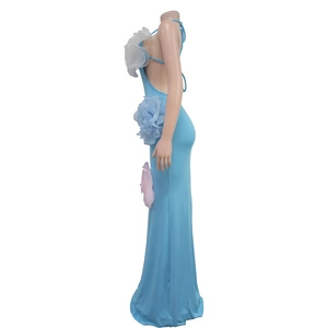 Detail view of light blue halter maxi dress featuring three 3D floral accents on the side