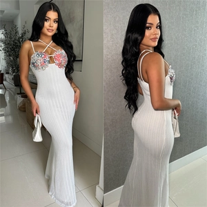 White ribbed knit maxi dress with sequin beaded bodice and thin criss-cross straps