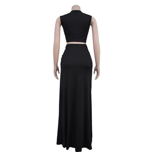 Rear view of sleek black two-piece set featuring a sleeveless crop top and high-waisted maxi skirt