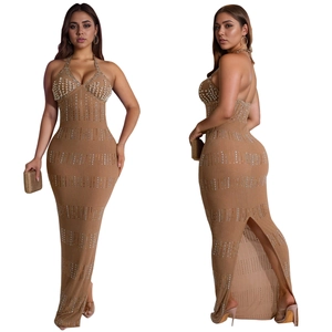 Detail of khaki halter neck maxi dress featuring faux pearls and silver rhinestones