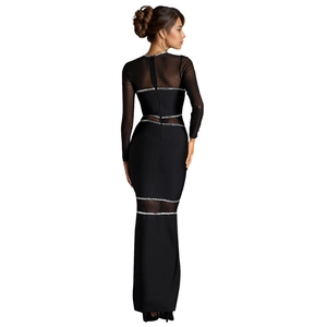 Detail view of the elegant black dress featuring mesh panels and silver sequined stripes