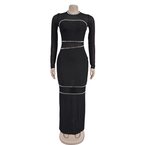 Detail of sheer mesh sleeves and silver rhinestone patterns on a black maxi dress