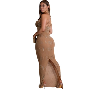 Detailed back view of a champagne bodycon dress featuring rhinestones and high slit