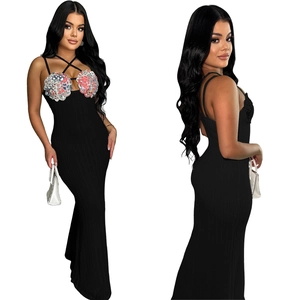 Detail of ribbed knit maxi dress with colorful floral applique and crisscross neck straps