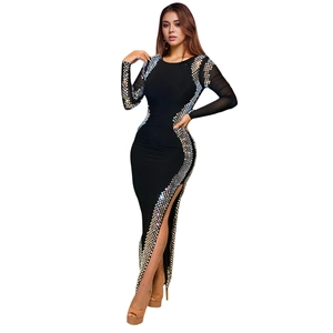 Detail of black long sleeve bodycon dress with silver sequins and side slit
