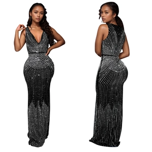 Detail of elegant black slim fit evening dress with silver rhinestone stripe patterns